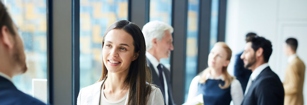 Image of pretty business lady talking to colleagues.
